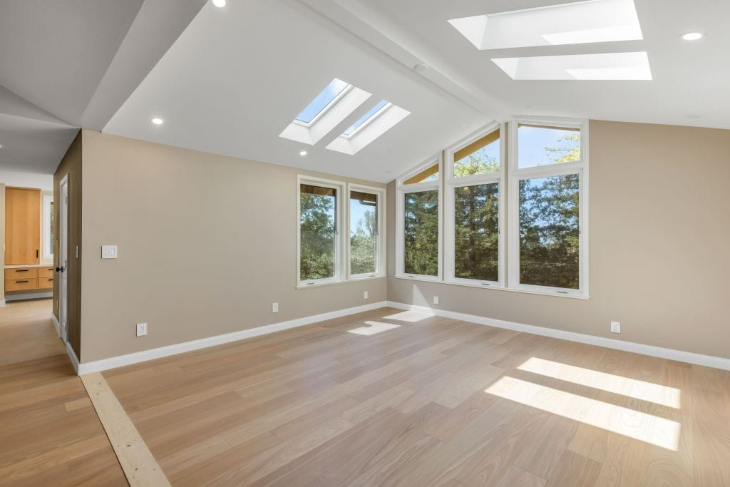 attic conversion beige walls large skylights denver co