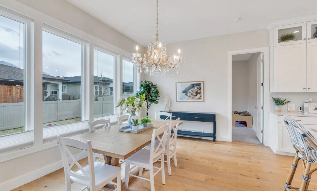 bright dining room wooden table white chairs chandelier kitchen remodeling denver co