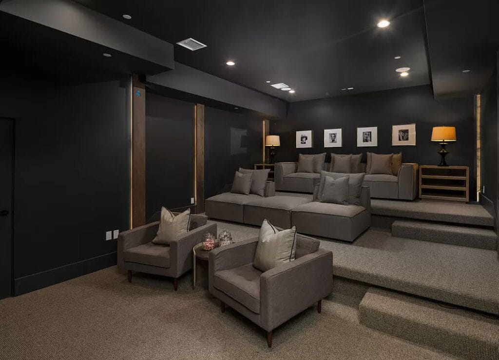 carpeted basement home theater room dark walls grey armchairs denver co