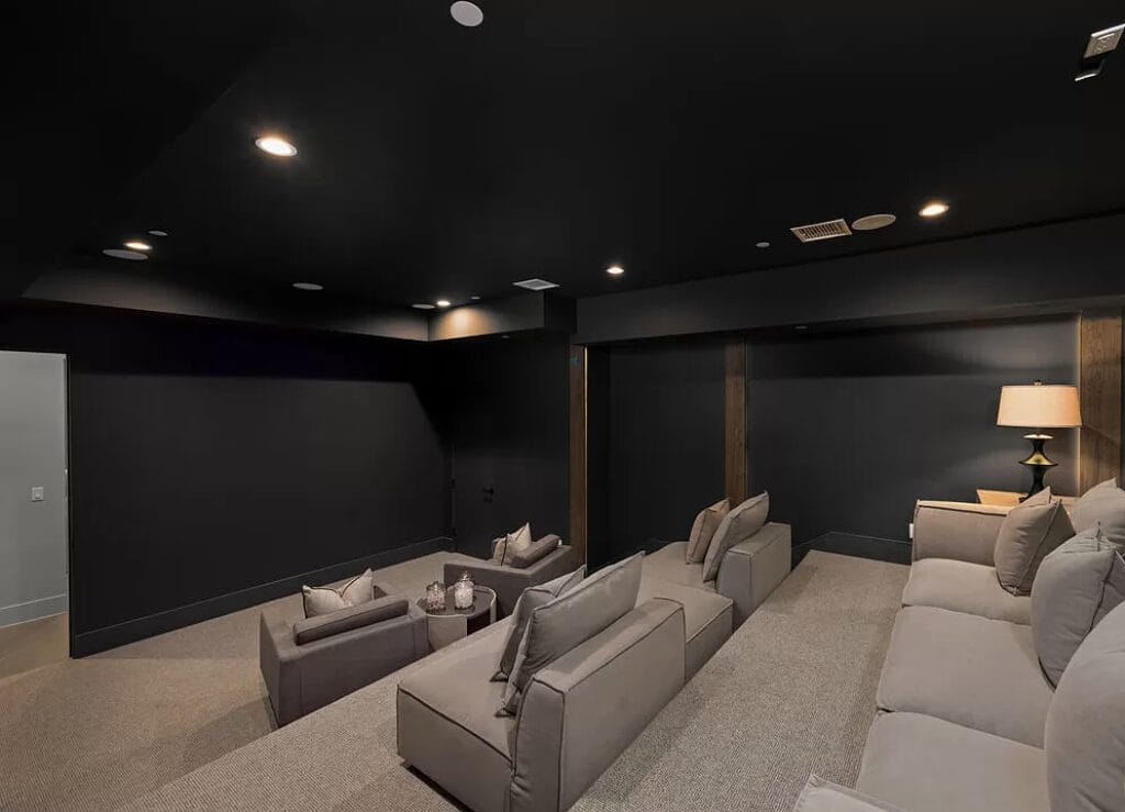 entertainment room addition dark walls grey seating denver co