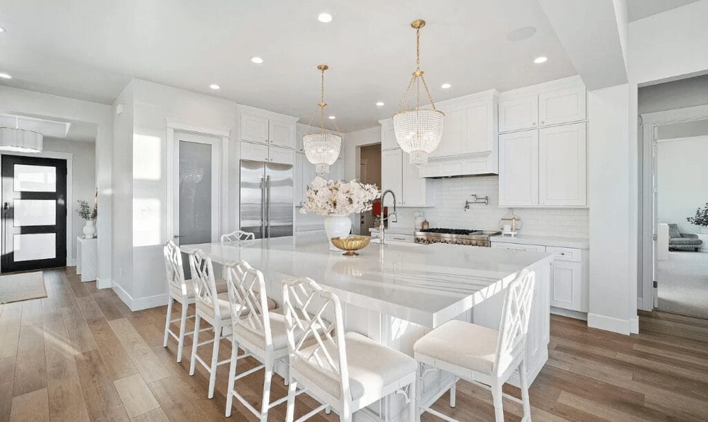 kitchen white cabinets countertop ornate chandeliers denver co